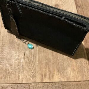 Black hide clutch bag by “Rebecca Norman”